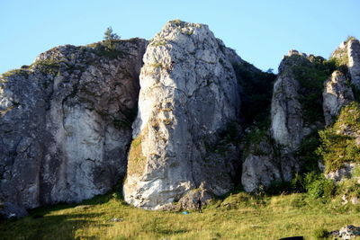 Low angle view of rock formation against sky