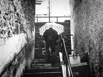 Man walking on railing