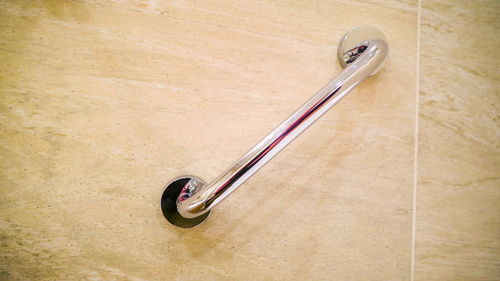 High angle view of bicycle on wooden table