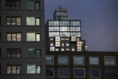 Low angle view of modern buildings against sky