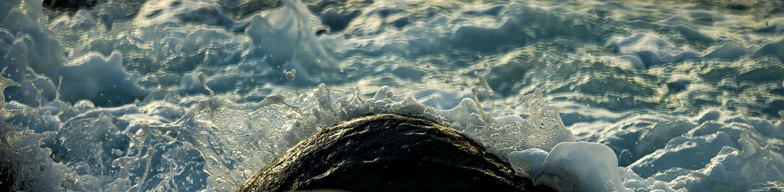 Woman splashing water in sea