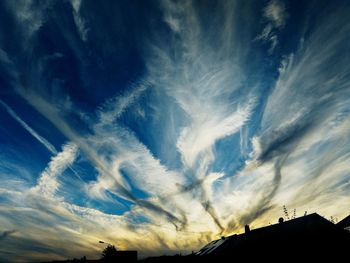 Low angle view of vapor trails in sky