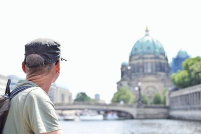Rear view of man looking at berlin cathedral