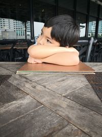 Portrait of woman sitting on bench