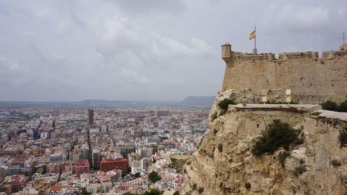 Buildings in city against sky