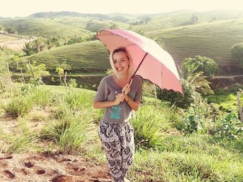 Portrait of smiling girl standing in farm