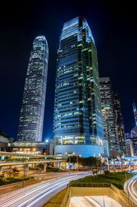 Illuminated city against clear sky at night