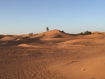 Scenic view of desert against clear sky