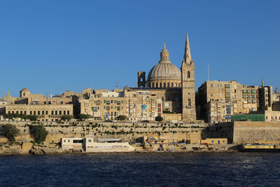 View of cathedral in sea against clear blue sky