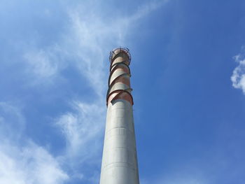 Low angle view of smoke stack against sky