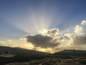 Scenic view of landscape against cloudy sky