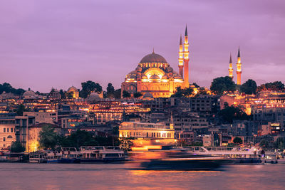 Illuminated buildings in city at night