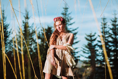 Woman standing by plants