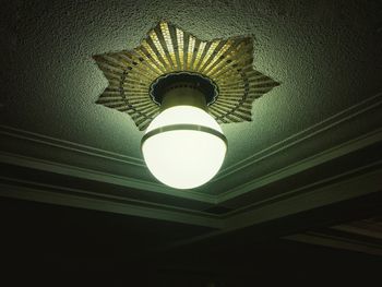 Low angle view of illuminated electric lamp