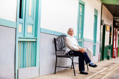 Senior woman traveling at the small town of salento, located on the region of quindio in colombia