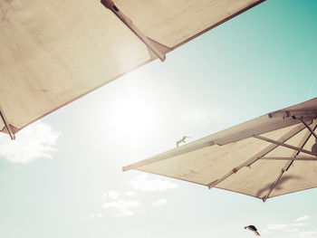 Low angle view of parasol against sky