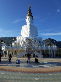Statue with people in background