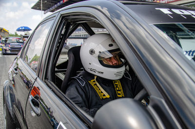 Portrait of man driving car