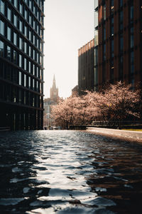 Tower clock reflected in water