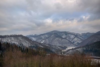 Scenic view of mountains against sky during winter