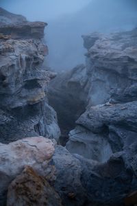 Scenic view of rock formations against sky