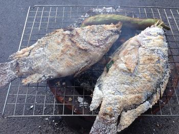 High angle view of meat on barbecue grill