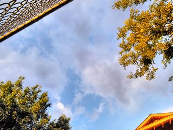 Low angle view of building against cloudy sky