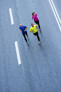 Three runners on road, stockholm, sweden