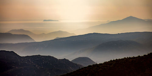 Scenic view of mountains against sky during sunset