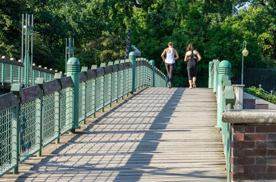 People walking on footbridge