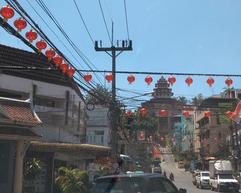 Street amidst buildings in city against sky