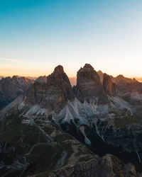 Scenic view of rocky mountains against sky during sunset