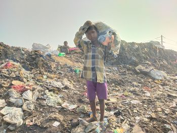 Rear view of man standing on rock