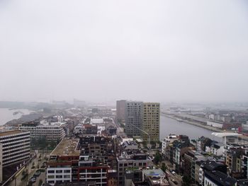 High angle view of buildings in city against sky