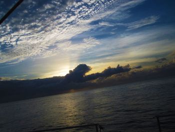 Scenic view of sea against sky at sunset