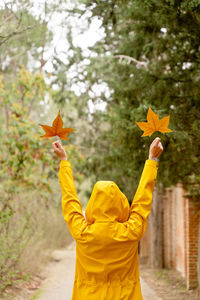 Woman holding autumn leaf