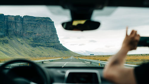 Cropped image of car on road