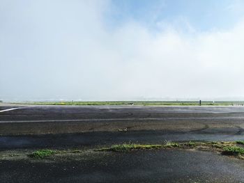 Road by land against sky