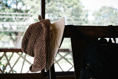 Close-up of chair on table against window