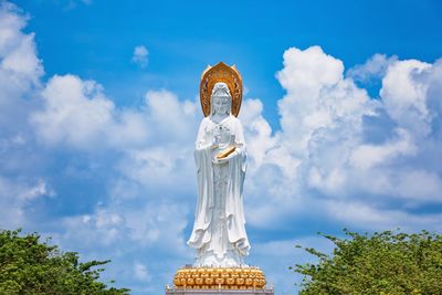 Low angle view of statue against sky