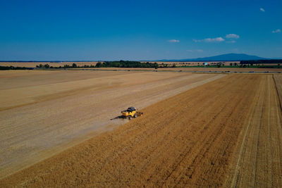 Combine harvester working in agricultural field. harvest season