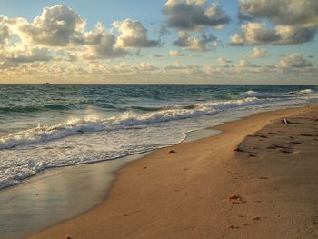 Scenic view of beach against sky