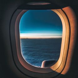 View of sea seen through airplane window