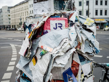 Close-up of clothes hanging on street