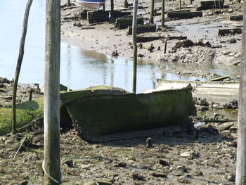 Abandoned boats moored in sea