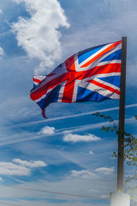 Low angle view of flag against sky