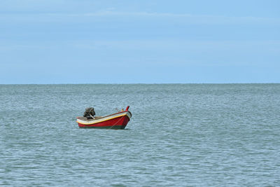 Boat on sea against sky