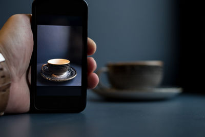 Close-up of coffee cup on table