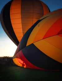 Multi colored hot air balloon against sky