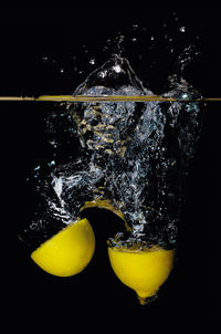 Close-up of yellow water against black background